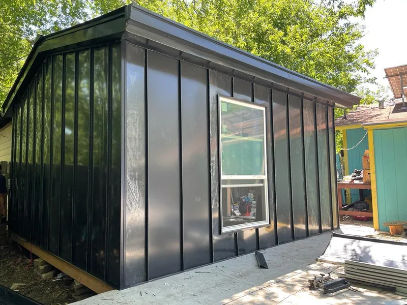 Black standing seam metal wall panels for Metal Roof Installation in Hugo