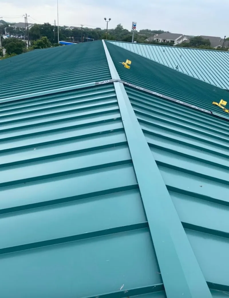 Green commercial metal roof ridge and valley for Metal Roof Repair in Hugo